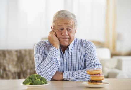 older man eating food