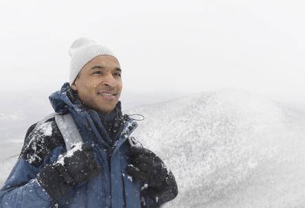 Photo: Man smiling outside in cold weather