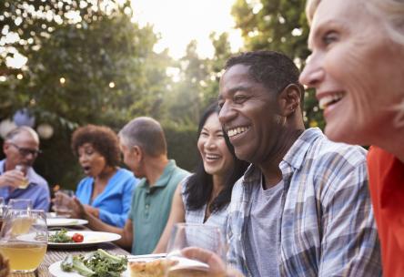 Photo: mature adults enjoying a meal outdoors