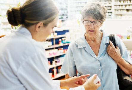 Photo: pharmacist explaining medication to customer
