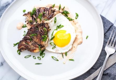 Maitake “Steak” and Eggs with Yogurt-Harissa Sauce