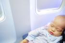 Baby sleeping on a plane