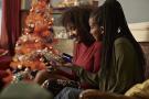 Young women ordering gifts online on a smartphone