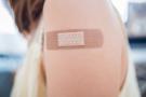 Photo: Woman's upper arm with bandage