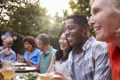 Photo: mature adults enjoying a meal outdoors
