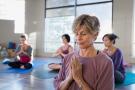 Photo: Woman meditating in yoga class